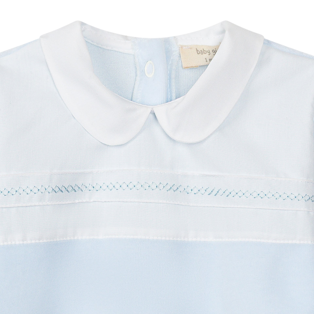 LilleLuxus Babygi blue and white baby romper with a Peter Pan collar and delicate smocked embroidery detail