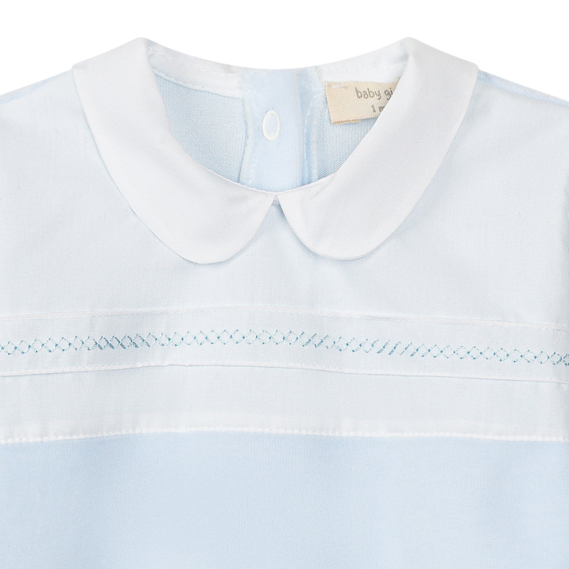 LilleLuxus Babygi blue and white baby romper with a Peter Pan collar and delicate smocked embroidery detail