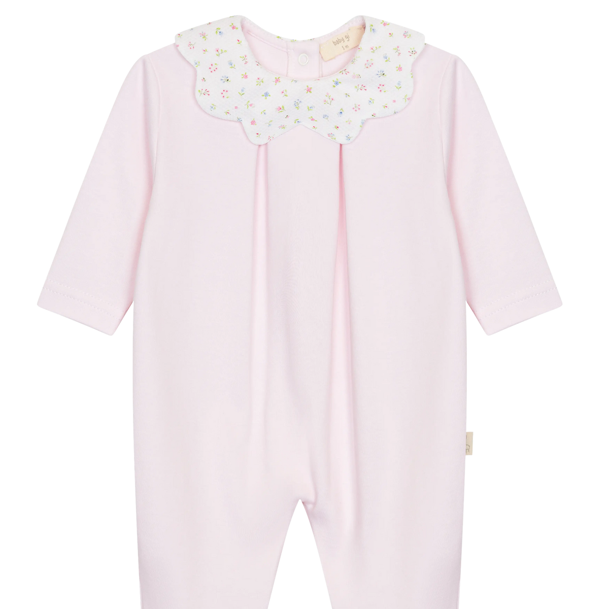LilleLuxus Babygi pink interlock cotton baby romper with a floral scalloped collar and long sleeves.