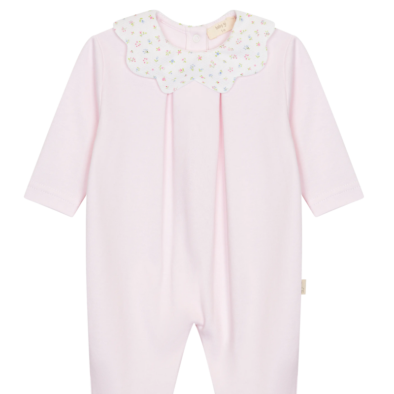 LilleLuxus Babygi pink interlock cotton baby romper with a floral scalloped collar and long sleeves.