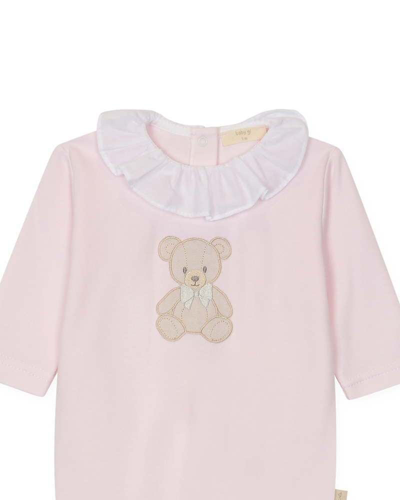 LilleLuxus Babygi pink interlock cotton baby onesie with a cute teddy bear motif and a white ruffled collar.