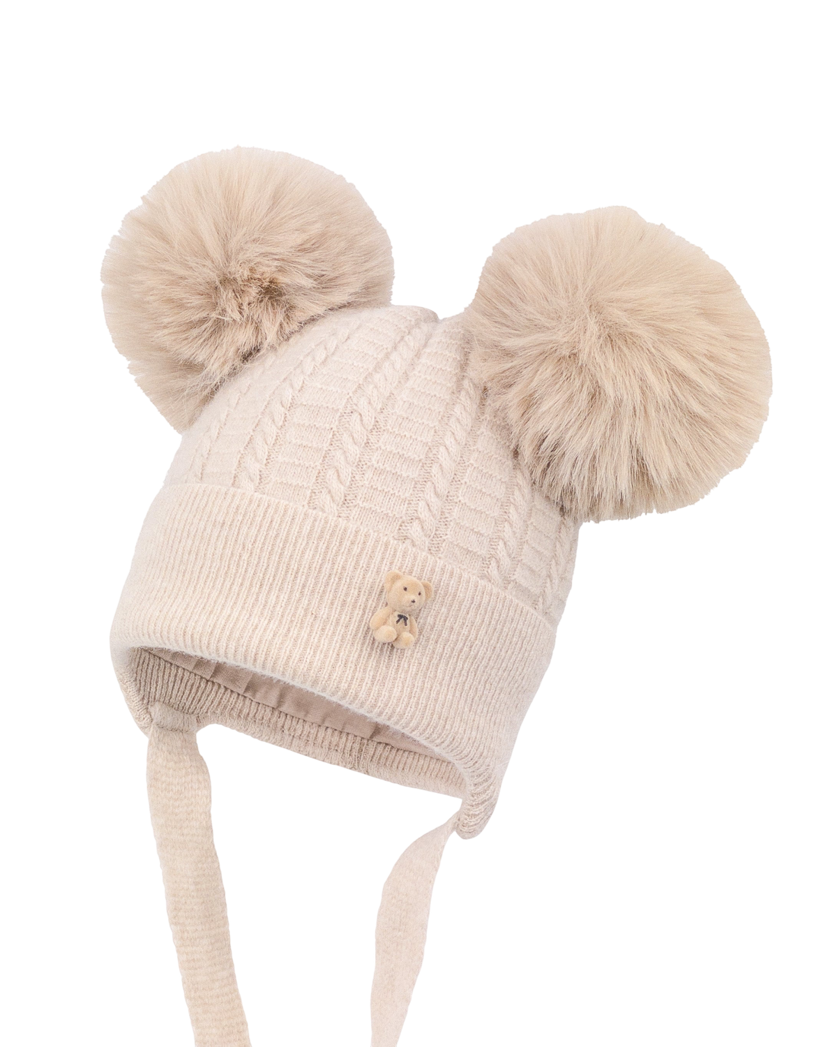 LilleLuxus Jamiks MORTIS beige merino wool baby hat with two faux fur pom-poms, cable knit pattern, and teddy bear pin.