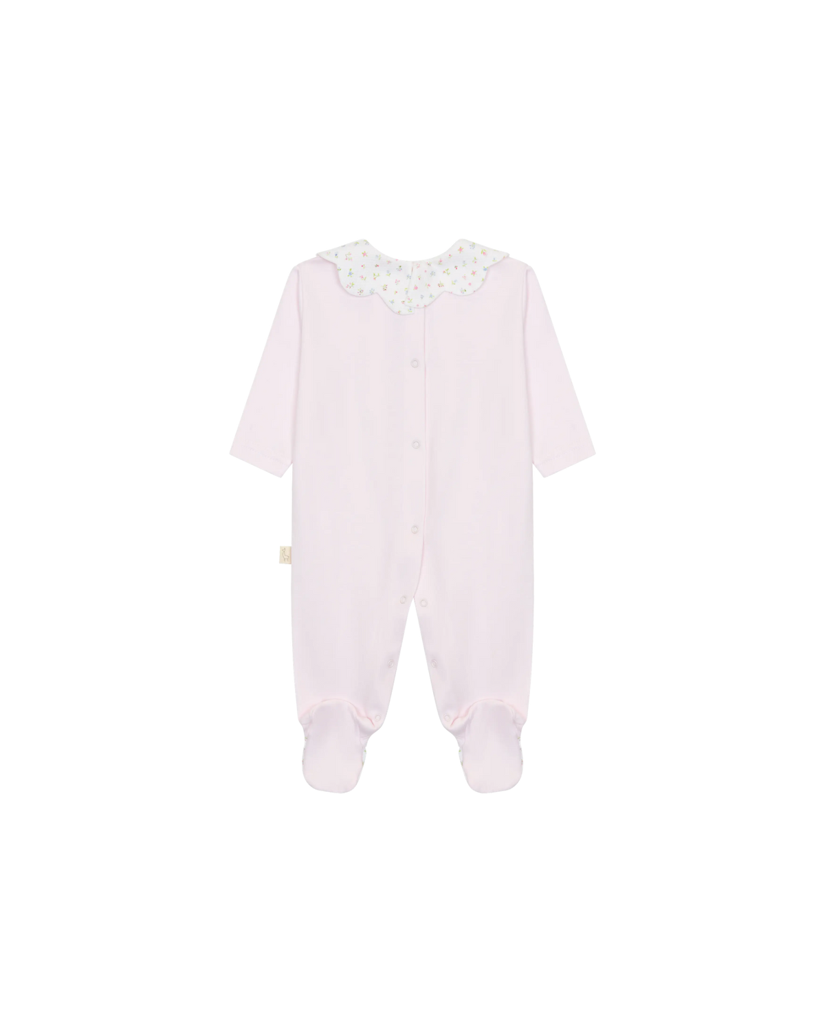 LilleLuxus baby footed sleeper in soft pink interlock cotton with a delicate floral scalloped collar, back view.