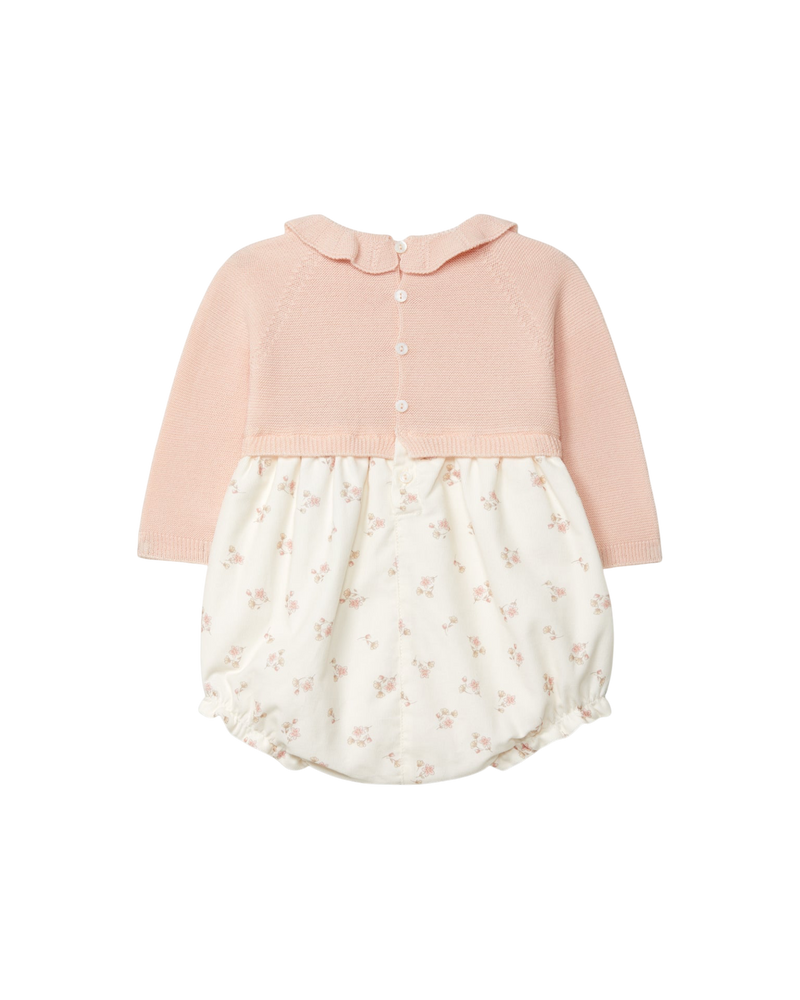 LilleLuxus Wedoble long-sleeved knit wool romper in pink with a floral print skirt and scalloped collar back view